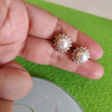 Arete dorado flor perla de rio-115