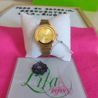 Reloj pulsa imán dorado
