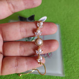 Pulsa fina en oro laminado con acero inoxidable Y perlas