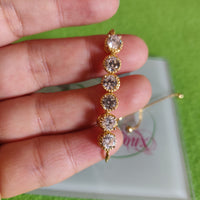 Pulsa fina en oro laminado con acero inoxidable