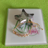 Pulsa fina en oro laminado con acero inoxidable