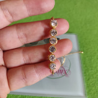 Pulsa fina en oro laminado con acero inoxidable