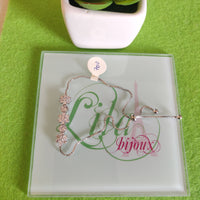 Pulsa fina en oro laminado con acero inoxidable