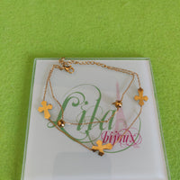 Tobillera dorada doble cruces