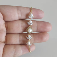 Pulsa fina en oro laminado con acero inoxidable Y perlas